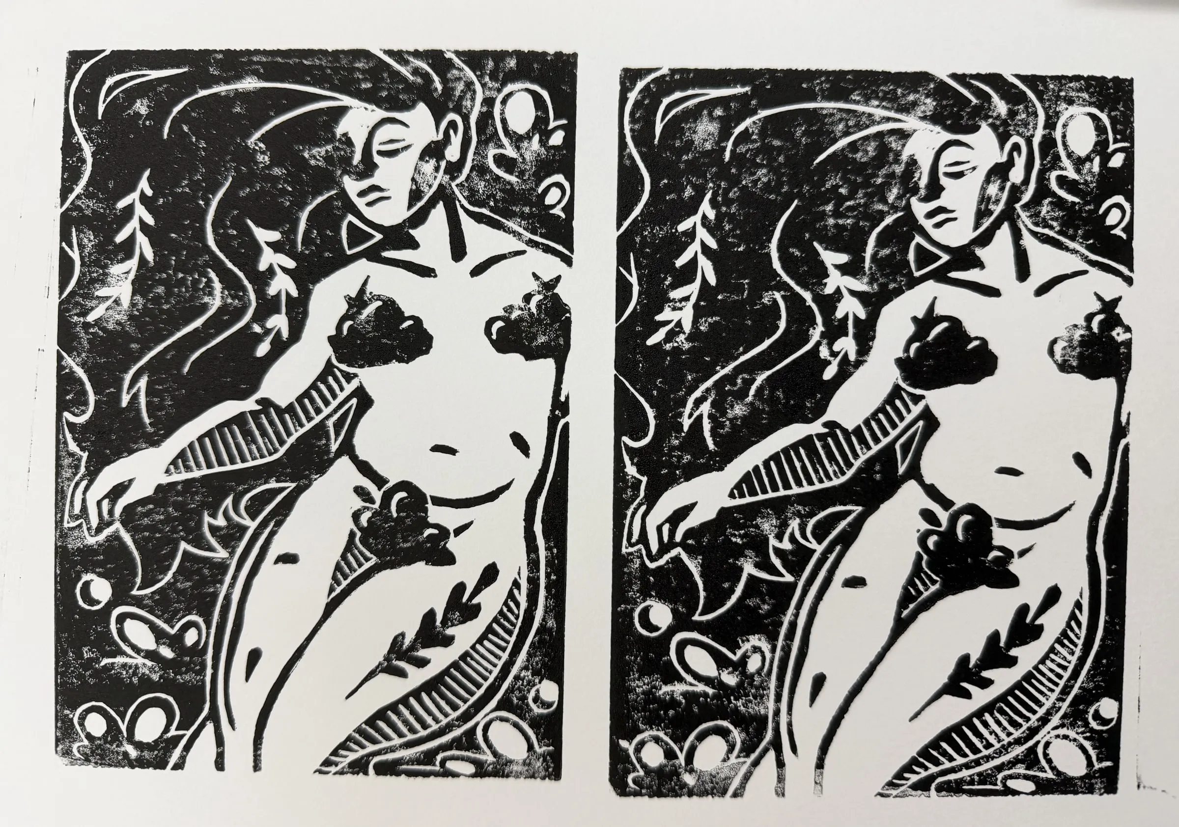 Two prints pulled from the block, inked in black on cream paper